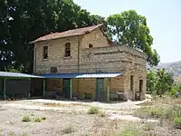 Former railway station of Al-Hamma, with a sign in Arabic reading "al-Hama".