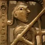 Figure presumed to be Longinus on the Clonmacnoise Crucifixion Plaque, c. 1090–1110