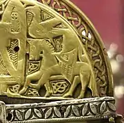 Rider and bird on the right-hand side of the Corp Naommh's cap