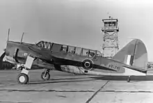 Black and white photo of a monoplane aircraft on the ground