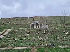 Ruined memorial spring in the village