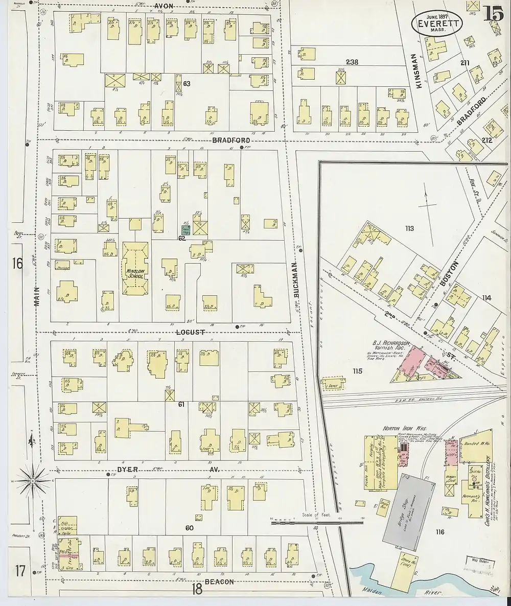 A section of an old property map, showing a small railroad station next to a three-track rail line