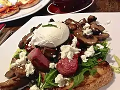 Sautéed field mushrooms on toast, with several additional ingredients