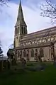 St Bartholomew's Church, Roby, Lancashire, 1875 by Ewan Christian, solidly built in rock-faced stone with ashlar dressings. The church has an impressive west steeple with a broach spire and has a prominent clerestory and an apsed chancel