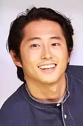 Yeun smiling