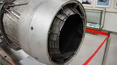 Adour afterburner showing nozzle area operating links and variable nozzle in 'no afterburning' or closed position. The air mass flow rate through the engine is not changed with the afterburner in operation because the area is increased to allow the increased volume hotter gas to escape.