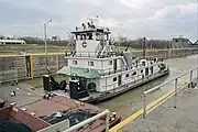 Towboat Enid Dibert departing main lock at McAlpine Locks on Ohio River, Louisville, Kentucky, USA, 1999