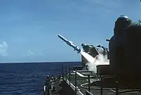 An RGM-84A Harpoon antiship cruise missile is fired from a Mark 11 launcher aboard the guided missile destroyer USS Lawrence