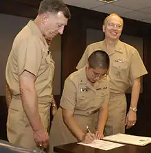 LTJG Shin signs her oath of office to become the first Buddhist chaplain in the US Military in 2004