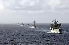 Wave Ruler (foreground), USS Mahan, Almirante Latorre, Sachsen, and USS Samuel B. Roberts navigate in formation.