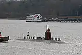 Sailors man the rails as the submarine transits the Thames River en route to Naval Submarine Base New London after an eight-month deployment. (2 December 2009)