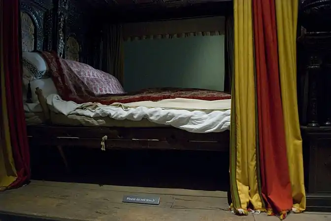 Bedclothes pulled back to show the bedcords of the 1590s Great Bed of Ware