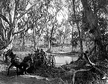 Walter Baldwin Spencer - Crossing Salt Creek near the Roper River, July 1911